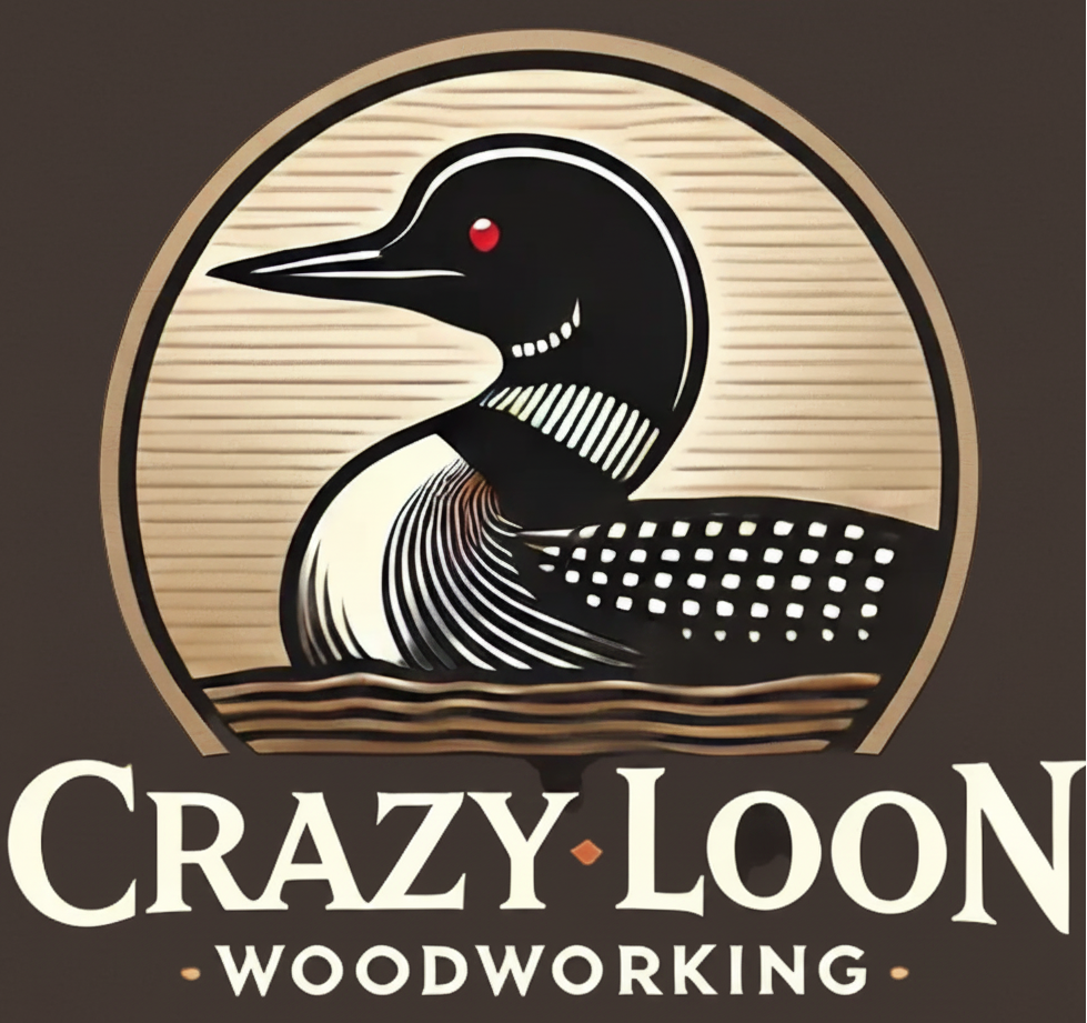 A stylized wood carving logo featuring a loon head inside a circular frame, with the text 'Crazy Loon Woodworking' and small numbers '177' on a dark brown background.